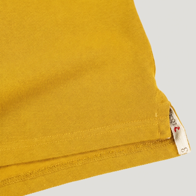 Australia 1899 Crest Adults Classic Cotton Polo Shirt Gold - Hem Close-up